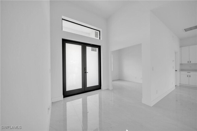 643 Knapp St, Lehigh Acres, FL 33974 - entryway featuring french doors and baseboards
