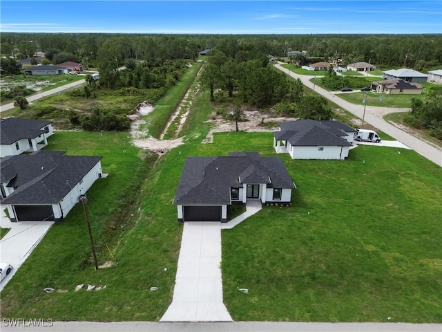 643 Knapp St, Lehigh Acres, FL 33974 - aerial perspective of suburban area with a heavily wooded area
