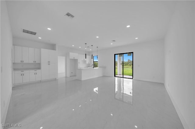 643 Knapp St, Lehigh Acres, FL 33974 - unfurnished living room featuring baseboards and recessed lighting