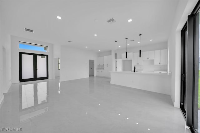 643 Knapp St, Lehigh Acres, FL 33974 - unfurnished living room with a sink and recessed lighting