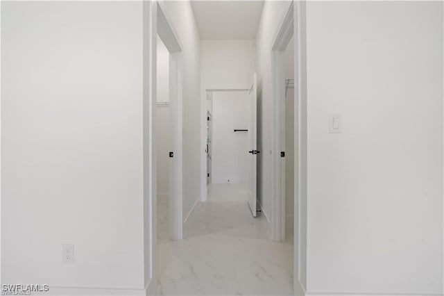643 Knapp St, Lehigh Acres, FL 33974 - hallway with marble look tile flooring and baseboards