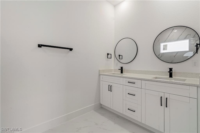 643 Knapp St, Lehigh Acres, FL 33974 - bathroom with baseboards, double vanity, and marble look tile flooring
