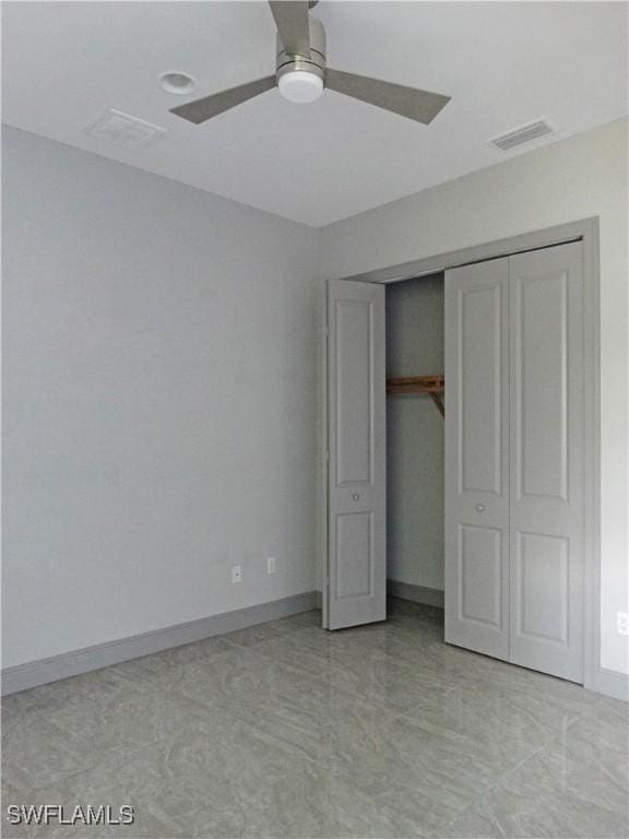 3120 68th St SW, Naples, FL 34105 - unfurnished bedroom with a closet and a ceiling fan