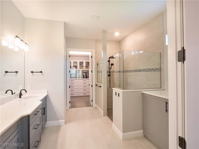 19449 The Place Blvd, Estero, FL 33928 - full bath with a stall shower, vanity, a spacious closet, baseboards, and recessed lighting