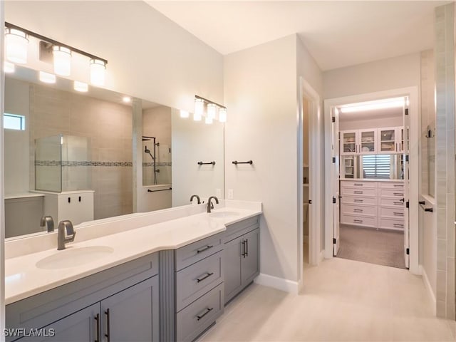 19449 The Place Blvd, Estero, FL 33928 - full bath with double vanity, a walk in closet, walk in shower, and tile patterned floors
