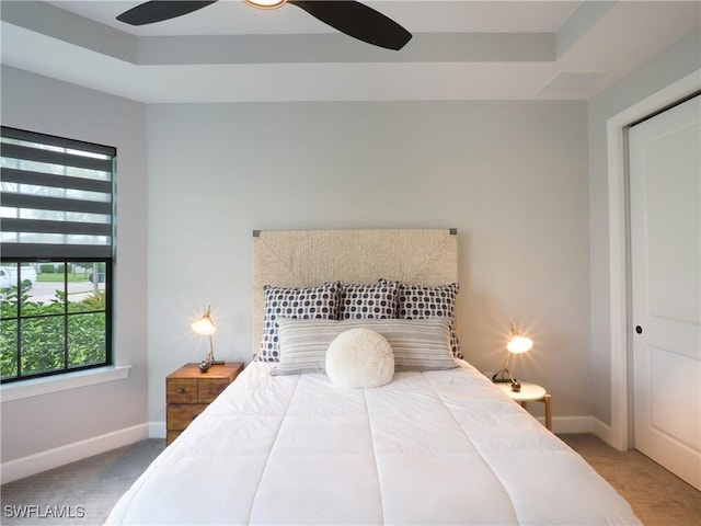19449 The Place Blvd, Estero, FL 33928 - bedroom featuring carpet, multiple windows, baseboards, and a tray ceiling