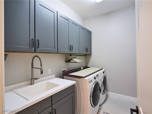 19449 The Place Blvd, Estero, FL 33928 - washroom featuring cabinet space, washing machine and dryer, and baseboards