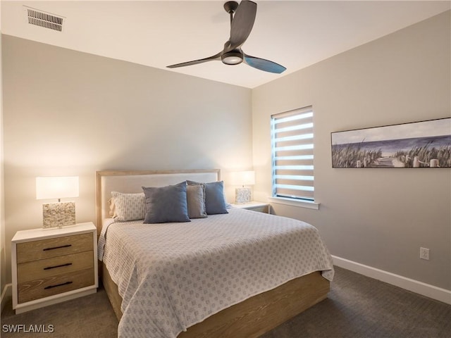 19449 The Place Blvd, Estero, FL 33928 - bedroom with dark colored carpet, baseboards, and ceiling fan