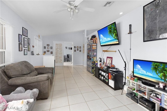 866 Carbon St E, Lehigh Acres, FL 33974 - living area with light tile patterned flooring, ceiling fan, and vaulted ceiling