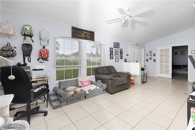 866 Carbon St E, Lehigh Acres, FL 33974 - living room featuring vaulted ceiling, a desk, light tile patterned floors, and ceiling fan