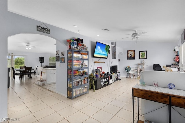 866 Carbon St E, Lehigh Acres, FL 33974 - living area with ceiling fan, arched walkways, light tile patterned flooring, and recessed lighting
