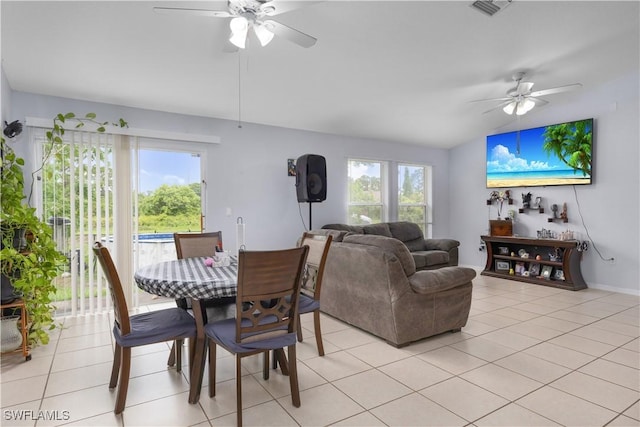 866 Carbon St E, Lehigh Acres, FL 33974 - dining space with ceiling fan, light tile patterned floors, lofted ceiling, and baseboards
