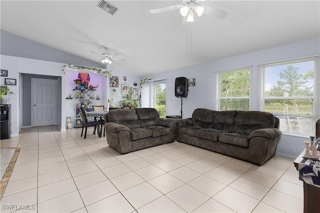 866 Carbon St E, Lehigh Acres, FL 33974 - living room featuring ceiling fan, lofted ceiling, and light tile patterned flooring