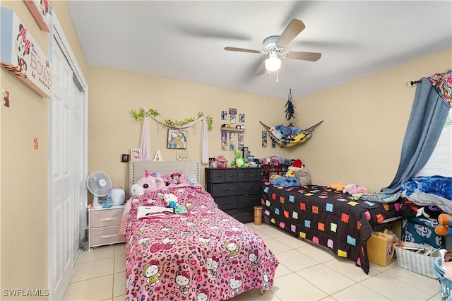 866 Carbon St E, Lehigh Acres, FL 33974 - tiled bedroom featuring a closet and ceiling fan