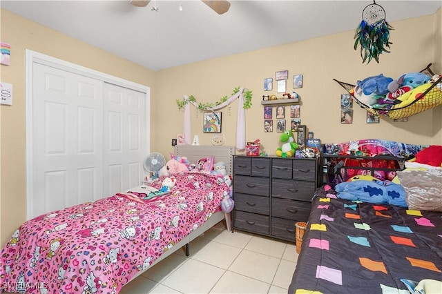 866 Carbon St E, Lehigh Acres, FL 33974 - tiled bedroom featuring a closet and ceiling fan