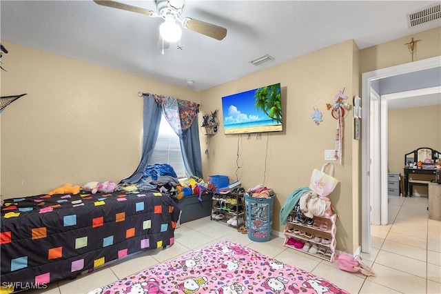 866 Carbon St E, Lehigh Acres, FL 33974 - tiled bedroom featuring ceiling fan