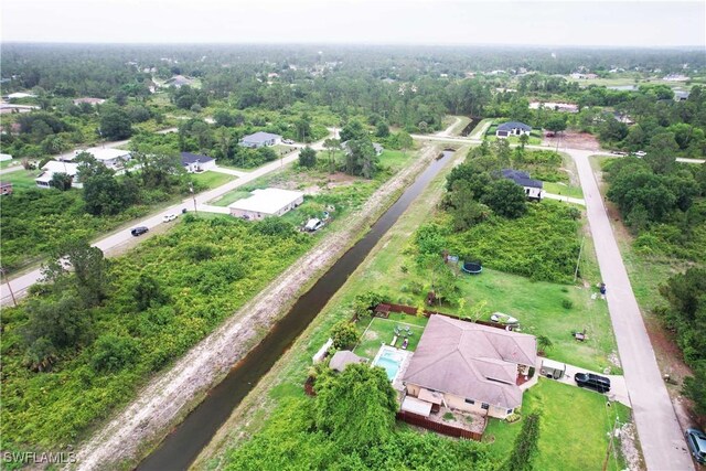 866 Carbon St E, Lehigh Acres, FL 33974 - aerial view of property and surrounding area with a large body of water