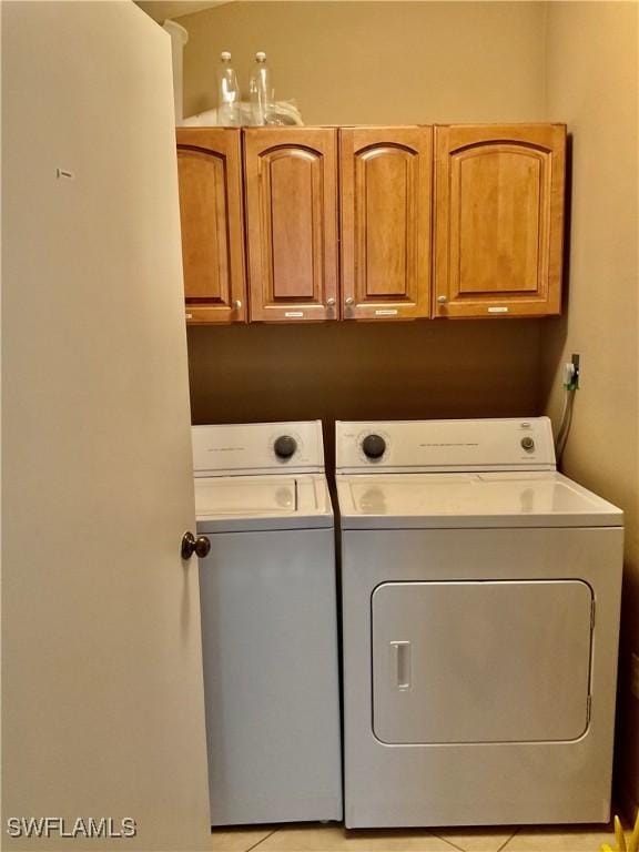 16276 Nautical Way Unit 1402, Bokeelia, FL 33922 - laundry room with washing machine and dryer and cabinet space