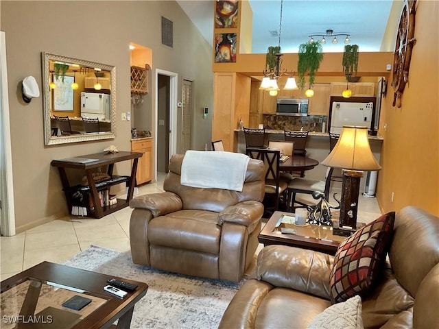 16276 Nautical Way Unit 1402, Bokeelia, FL 33922 - living area with light tile patterned floors and high vaulted ceiling