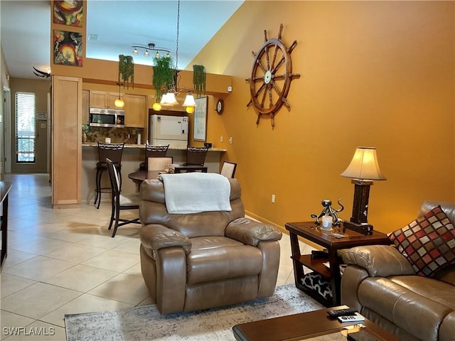 16276 Nautical Way Unit 1402, Bokeelia, FL 33922 - living room featuring light tile patterned flooring and a high ceiling