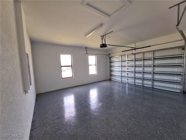 4956 30th Pl SW, Naples, FL 34116 - garage featuring a garage door opener