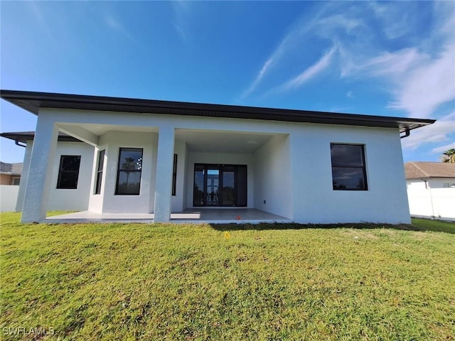 4956 30th Pl SW, Naples, FL 34116 - rear view of property featuring stucco siding and a patio