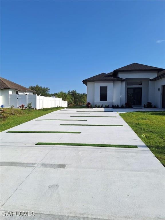 4956 30th Pl SW, Naples, FL 34116 - view of front of home featuring stucco siding