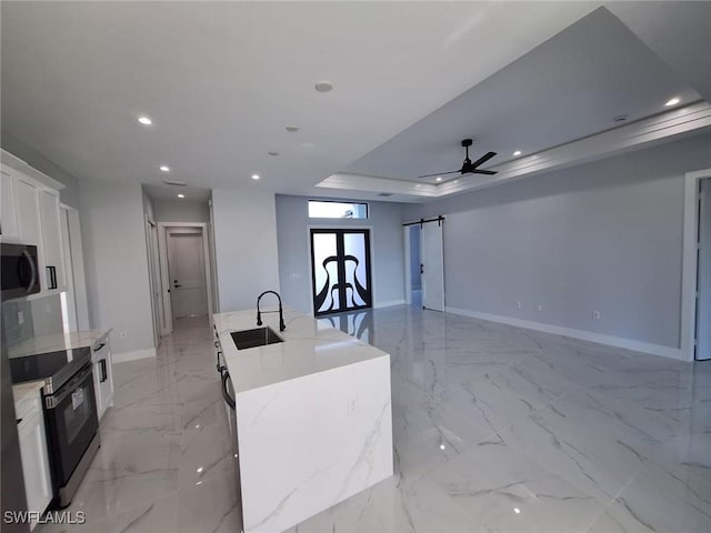4956 30th Pl SW, Naples, FL 34116 - kitchen with a sink, electric range, a barn door, recessed lighting, and baseboards