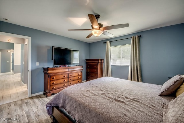 1719 Academy Blvd, Cape Coral, FL 33990 - bedroom with wood finished floors, ceiling fan, and baseboards