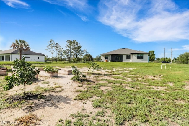 4119 43rd Ave NE, Naples, FL 34120 - view of green lawn with a garden