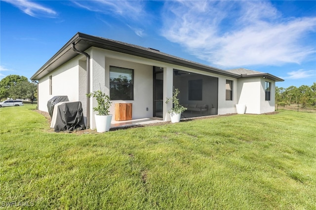 4119 43rd Ave NE, Naples, FL 34120 - back of property featuring a yard and stucco siding