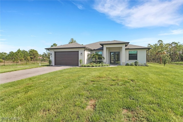 4119 43rd Ave NE, Naples, FL 34120 - prairie-style house featuring french doors, stucco siding, an attached garage, driveway, and a front yard