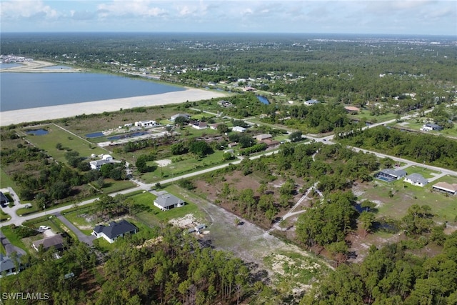 4119 43rd Ave NE, Naples, FL 34120 - view of property location with a nearby body of water and a heavily wooded area