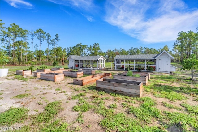 4119 43rd Ave NE, Naples, FL 34120 - view of yard with a vegetable garden and a storage unit