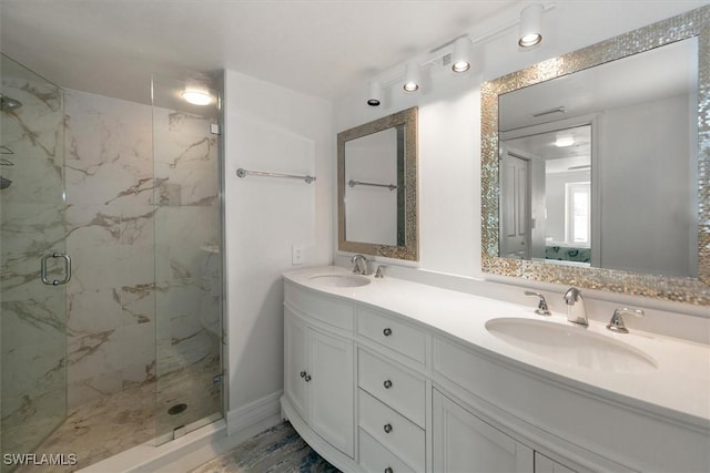 12541 Kelly Sands Way Unit 19, Fort Myers, FL 33908 - bathroom featuring a marble finish shower and double vanity