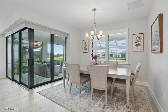 1870 Amador Ct, Naples, FL 34120 - dining room featuring a chandelier and baseboards