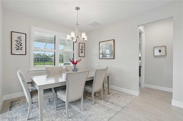 1870 Amador Ct, Naples, FL 34120 - dining area featuring a chandelier and wood finished floors