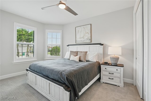 1870 Amador Ct, Naples, FL 34120 - bedroom with light colored carpet and a ceiling fan