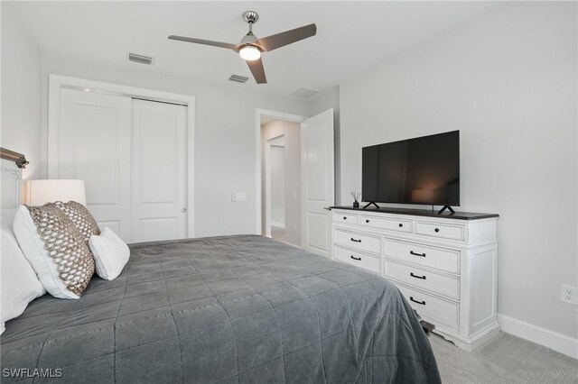 1870 Amador Ct, Naples, FL 34120 - bedroom featuring a closet, light colored carpet, and ceiling fan