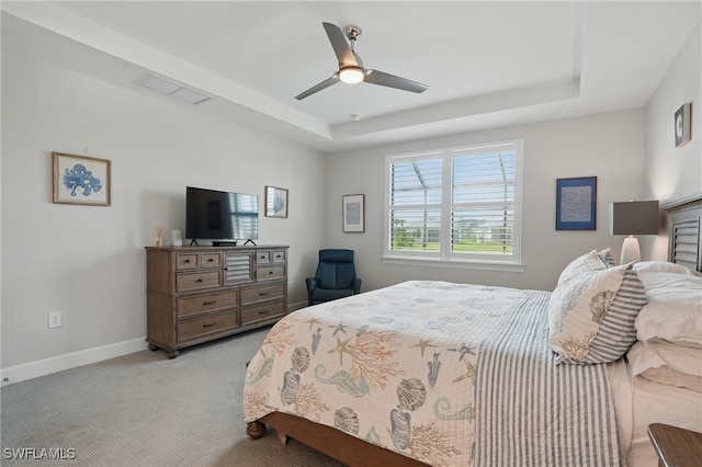 1870 Amador Ct, Naples, FL 34120 - bedroom featuring a raised ceiling, light colored carpet, and ceiling fan