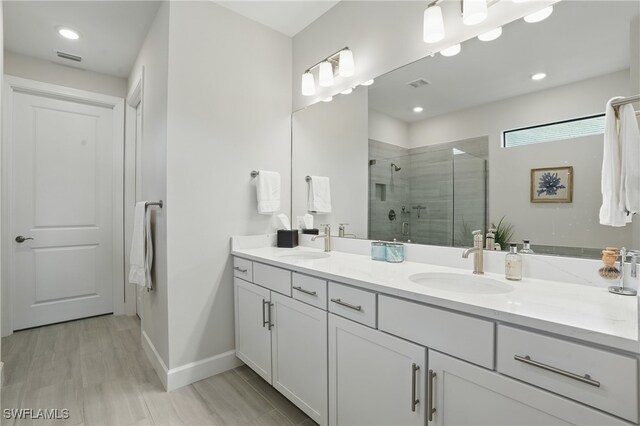 1870 Amador Ct, Naples, FL 34120 - full bathroom with double vanity, a shower stall, and recessed lighting