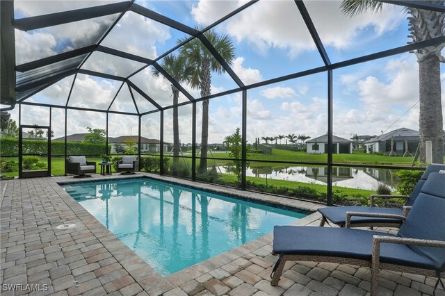 1870 Amador Ct, Naples, FL 34120 - outdoor pool featuring a patio area, a water view, and glass enclosure