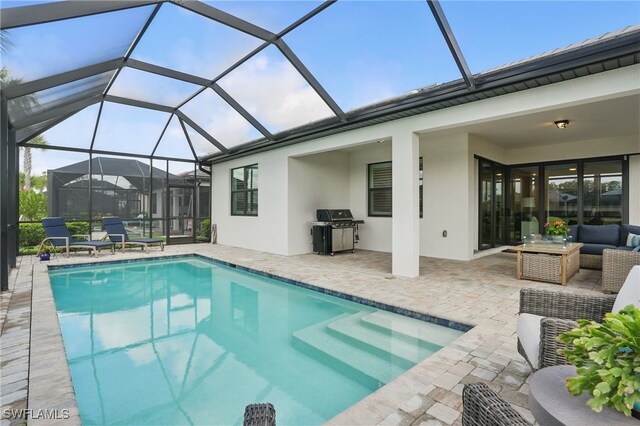 1870 Amador Ct, Naples, FL 34120 - swimming pool featuring a patio area, an outdoor living space, and area for grilling