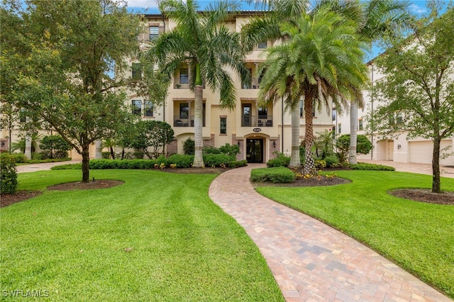 16382 Viansa Way Unit 3-202, Naples, FL 34110 - surrounding community featuring a yard
