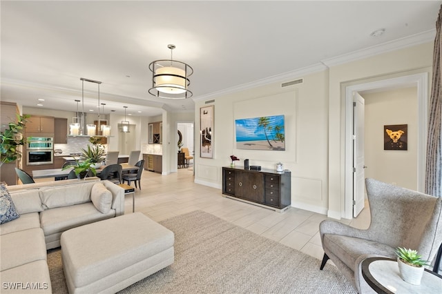 16382 Viansa Way Unit 3-202, Naples, FL 34110 - living room with crown molding and baseboards