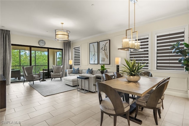 16382 Viansa Way Unit 3-202, Naples, FL 34110 - dining room with ornamental molding