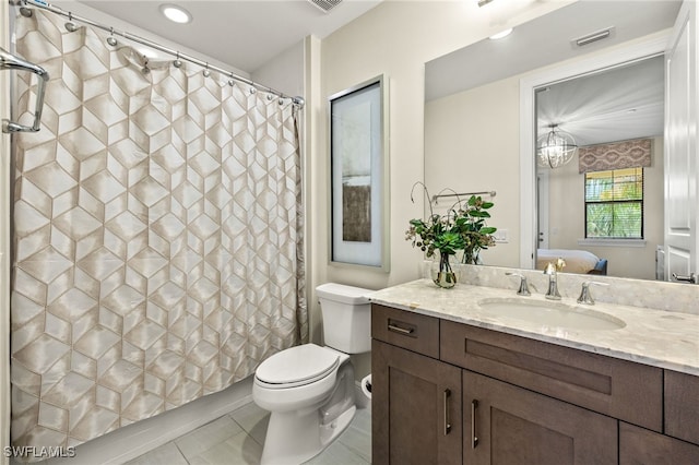 16382 Viansa Way Unit 3-202, Naples, FL 34110 - ensuite bathroom featuring vanity, toilet, tile patterned floors, and a shower with shower curtain