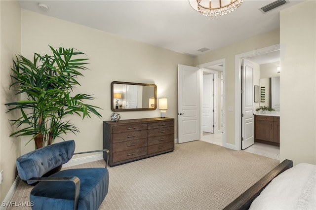 16382 Viansa Way Unit 3-202, Naples, FL 34110 - bedroom featuring baseboards, light carpet, and connected bathroom