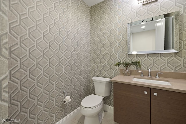 16382 Viansa Way Unit 3-202, Naples, FL 34110 - half bathroom with toilet, vanity, and wallpapered walls