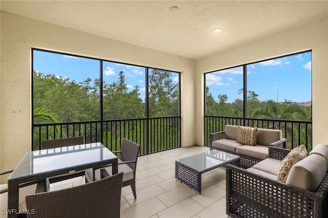 16382 Viansa Way Unit 3-202, Naples, FL 34110 - sunroom with healthy amount of natural light